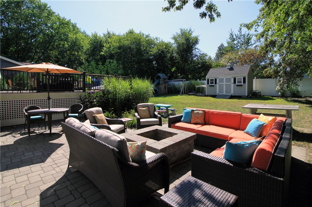 36 Seneca Road Portsmouth, RI 02871 - Photo 36 of 48 Back yard patio with fire pit.