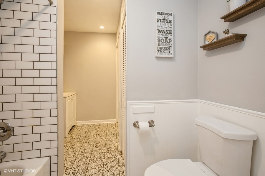 551 Ridge Circle Streamwood, IL 60107 - Photo 12 of 17 a bathroom with a toilet and a shower