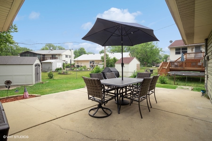 551 Ridge Circle Streamwood, IL 60107 - Photo 14 of 17 a view of a backyard with sitting area and furniture