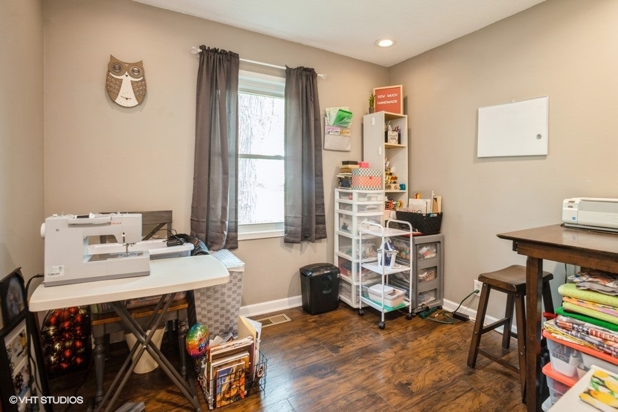 551 Ridge Circle Streamwood, IL 60107 - Photo 9 of 17 a view of a workspace with furniture and a window