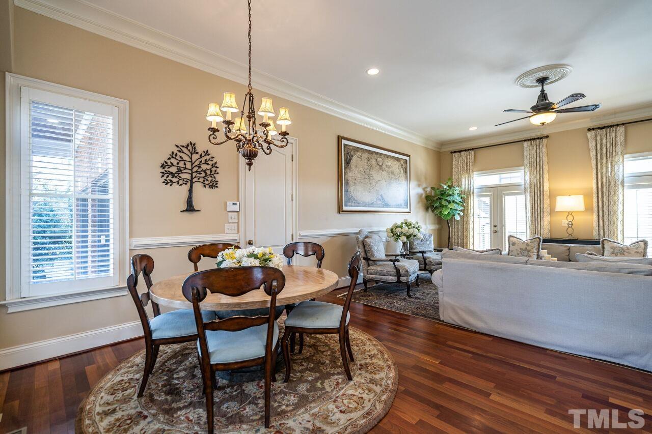 122 Lake Boone Trail Raleigh, NC 27608 - Photo 15 of 46 a dining room with furniture a chandelier and wooden floor