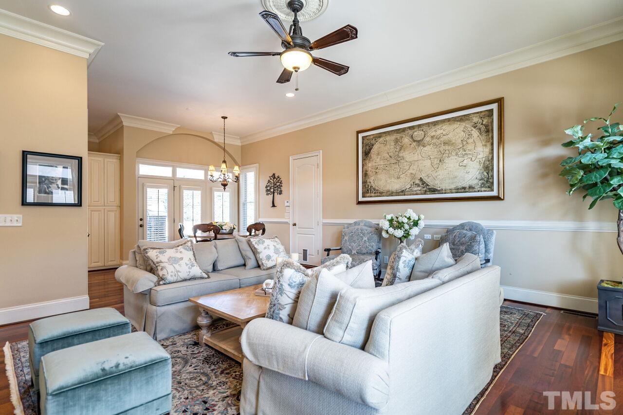 122 Lake Boone Trail Raleigh, NC 27608 - Photo 17 of 46 a living room with furniture a ceiling fan and a rug