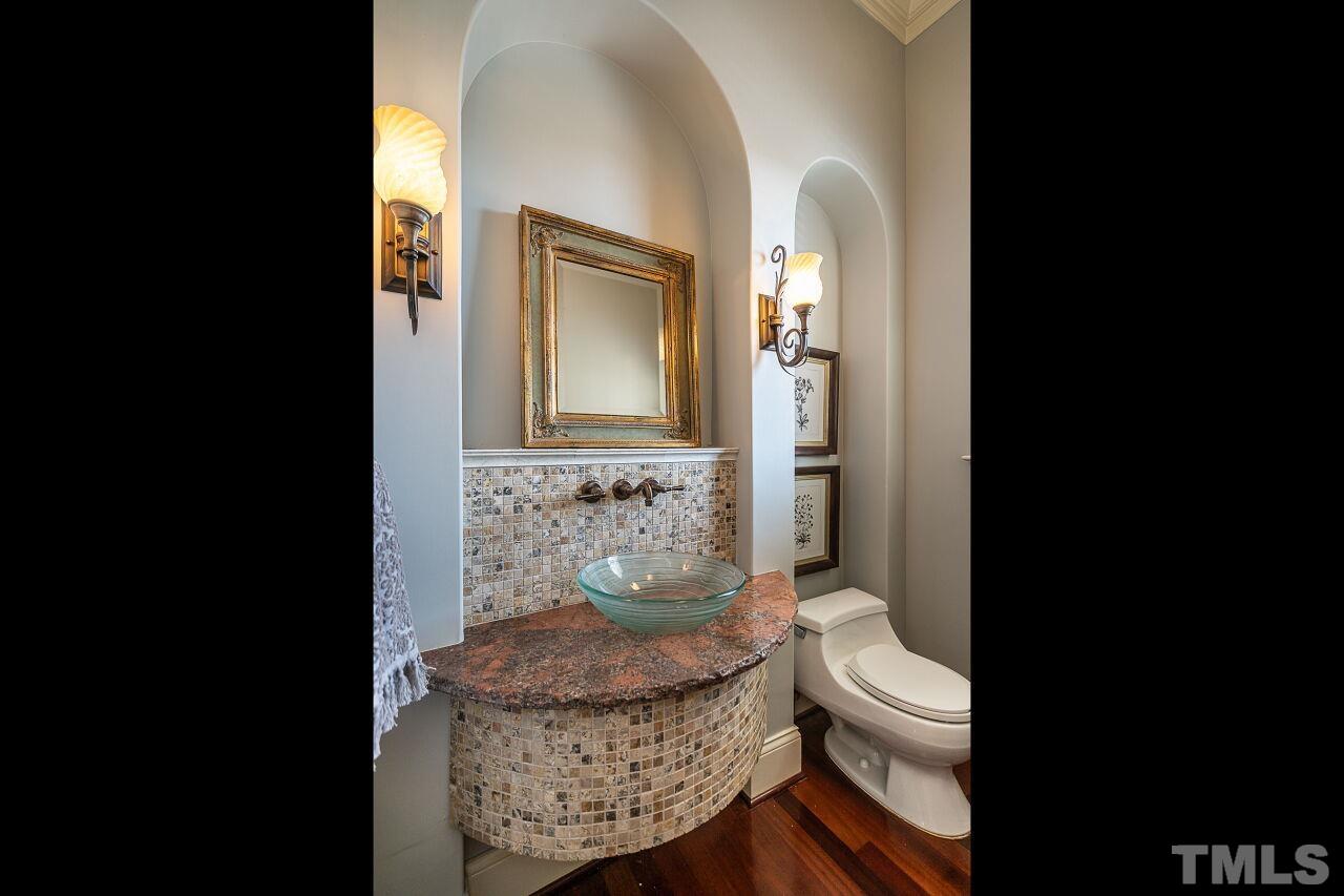 122 Lake Boone Trail Raleigh, NC 27608 - Photo 21 of 46 a bathroom with a granite countertop toilet sink and mirror