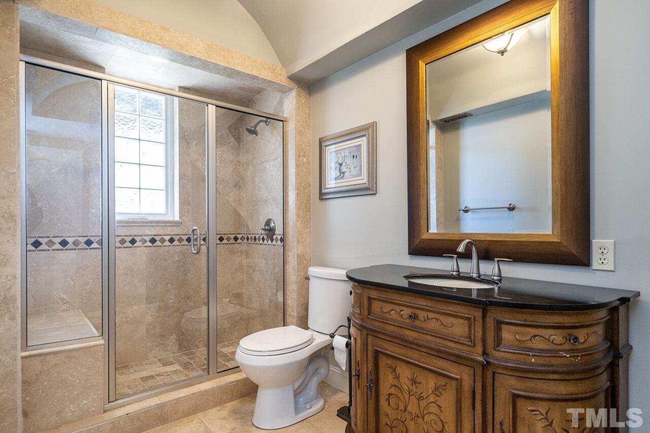 122 Lake Boone Trail Raleigh, NC 27608 - Photo 42 of 46 a bathroom with a sink a toilet and shower