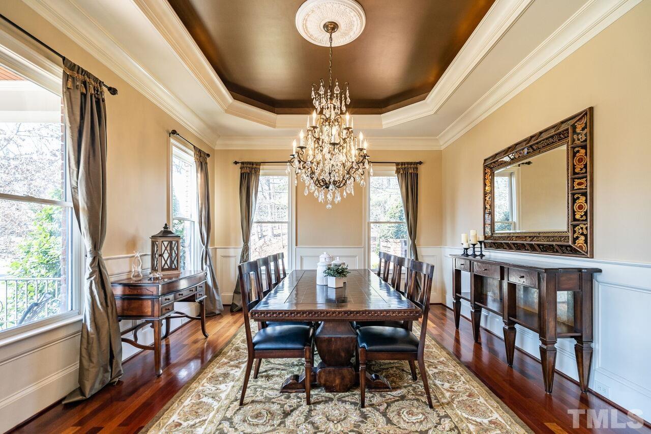 122 Lake Boone Trail Raleigh, NC 27608 - Photo 8 of 46 a view of a dining room with furniture window and wooden floor