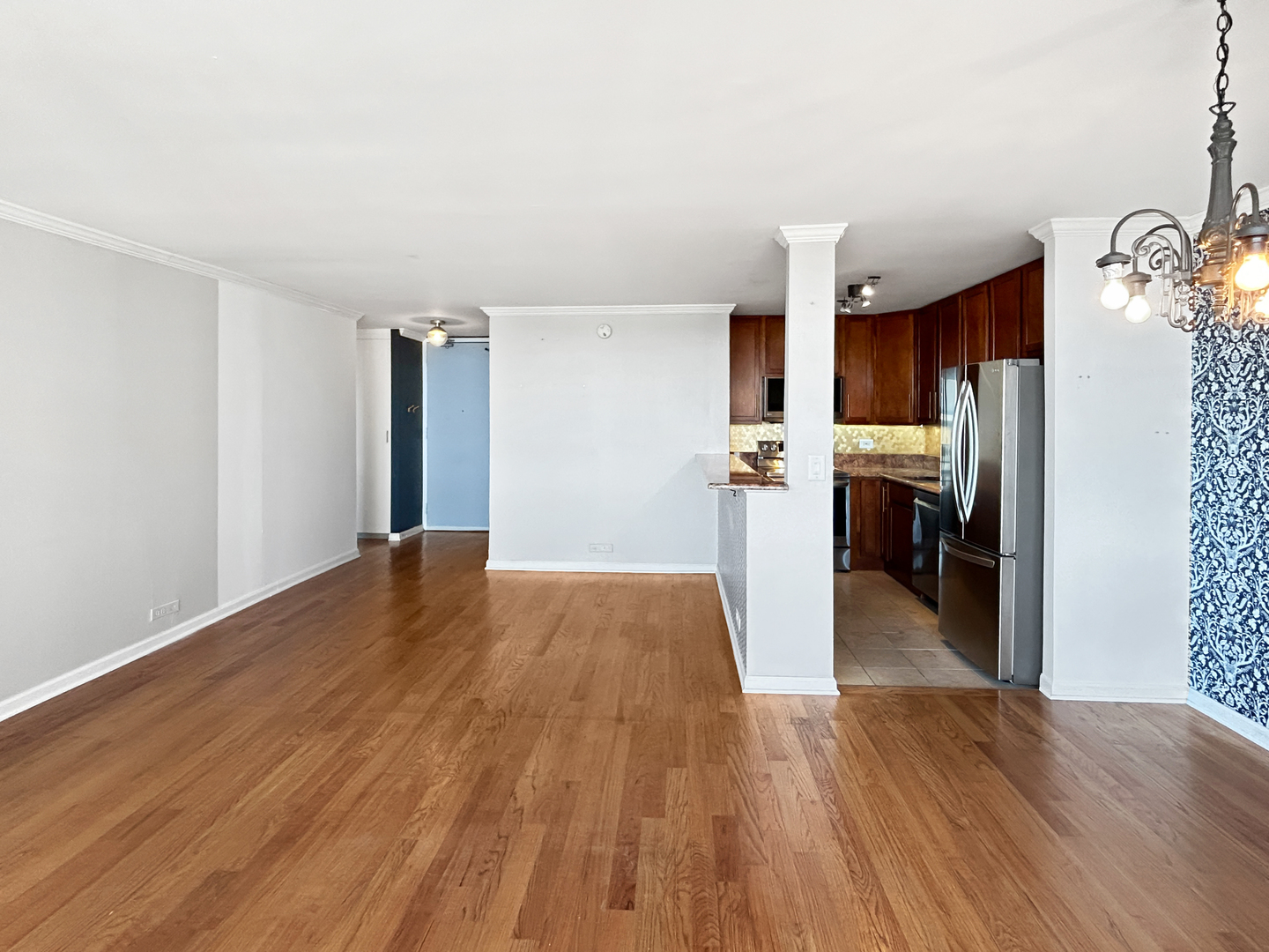 655 West Irving Park Road, Unit 3608 Chicago, IL 60613 - Photo 3 of 20 a view of a kitchen from the hallway