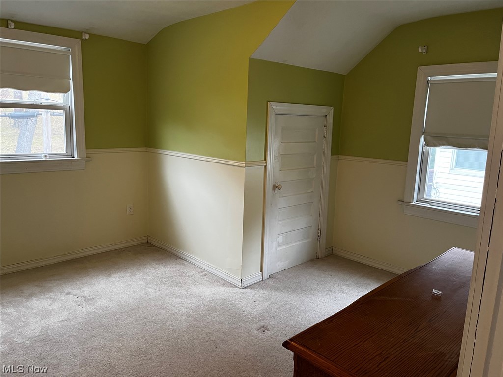 1610 Malasia Road Akron, OH 44305 - Photo 8 of 14 Unfurnished bedroom featuring light colored carpet