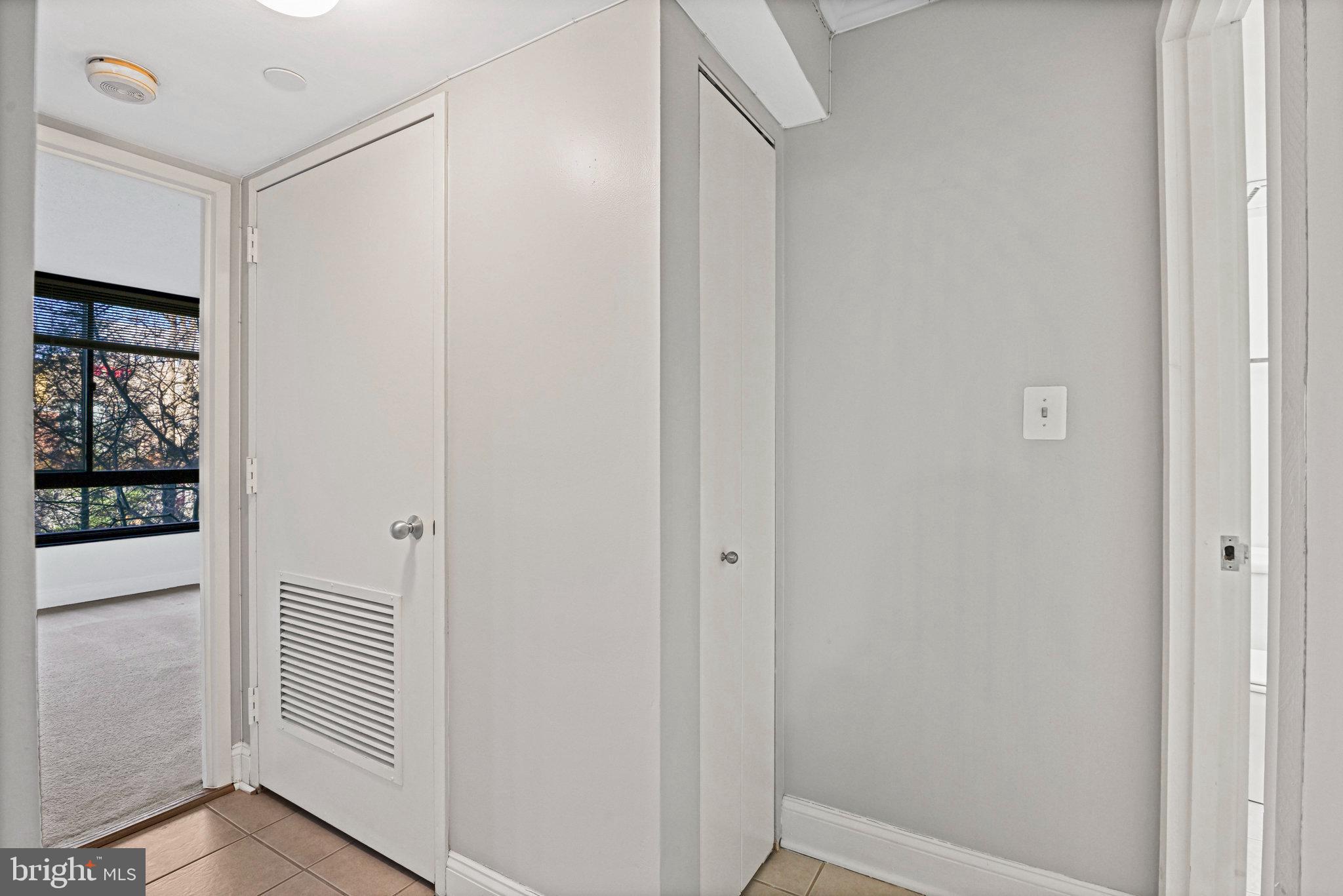 1808 Old Meadow Road, Unit 716 McLean, VA 22102 - Photo 14 of 36 a view of a hallway with closet