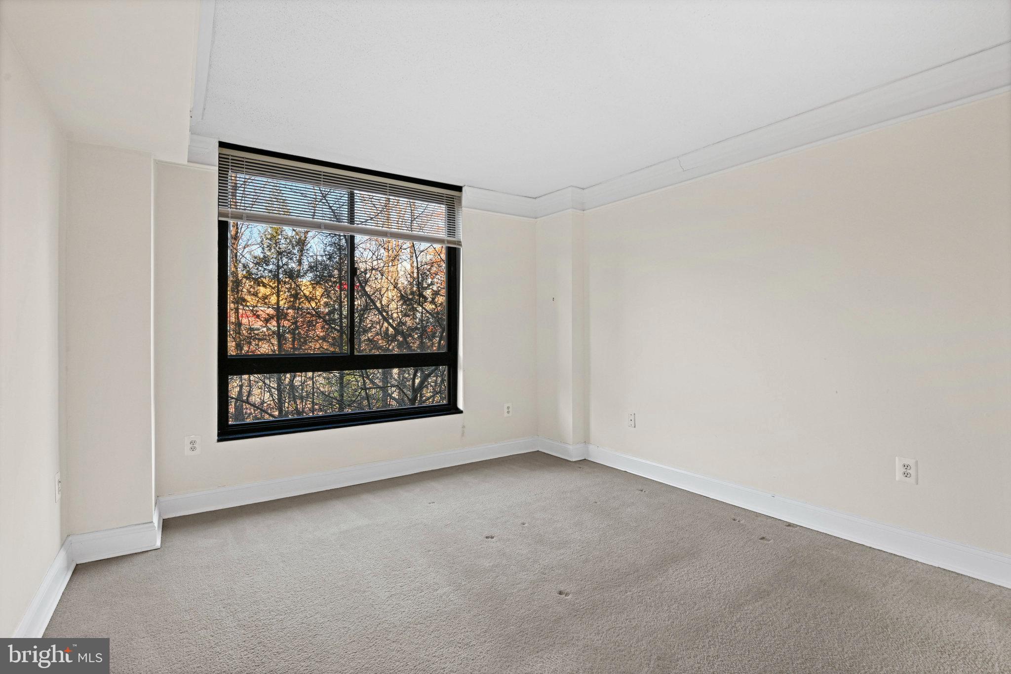 1808 Old Meadow Road, Unit 716 McLean, VA 22102 - Photo 19 of 36 a view of a big room with windows and chandelier fan