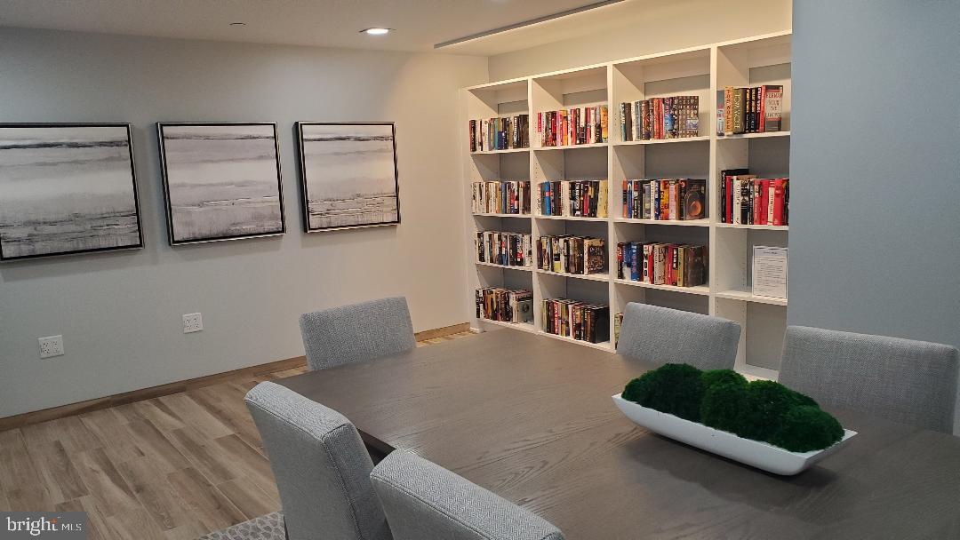 1808 Old Meadow Road, Unit 716 McLean, VA 22102 - Photo 24 of 36 a livingroom with a book shelf