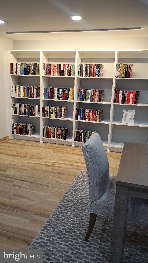 1808 Old Meadow Road, Unit 716 McLean, VA 22102 - Photo 26 of 36 a workspace with a book shelf