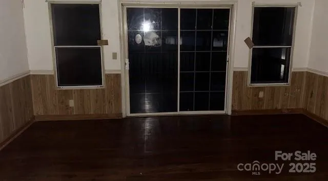 a view of empty room with windows