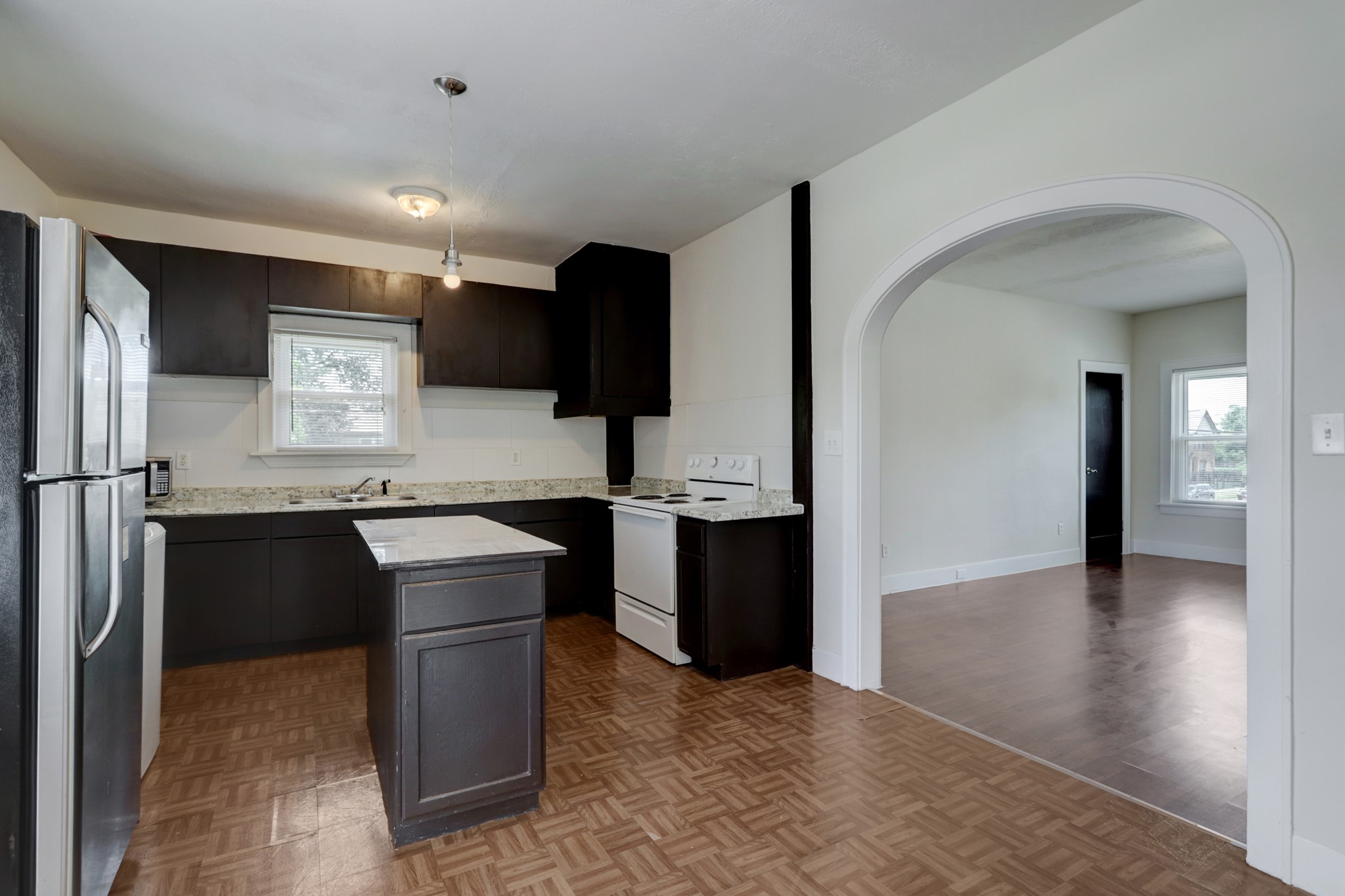 3002 Isabella Street Houston, TX 77004 - Photo 17 of 18 a kitchen with a refrigerator and a sink