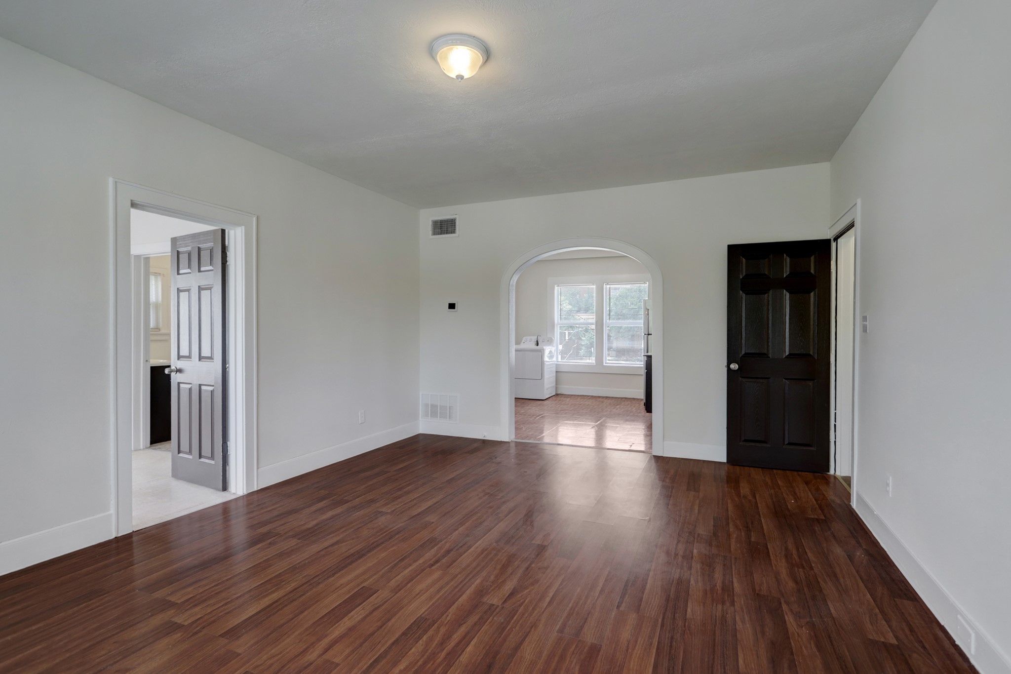 3002 Isabella Street Houston, TX 77004 - Photo 10 of 18 a view of empty room with wooden floor