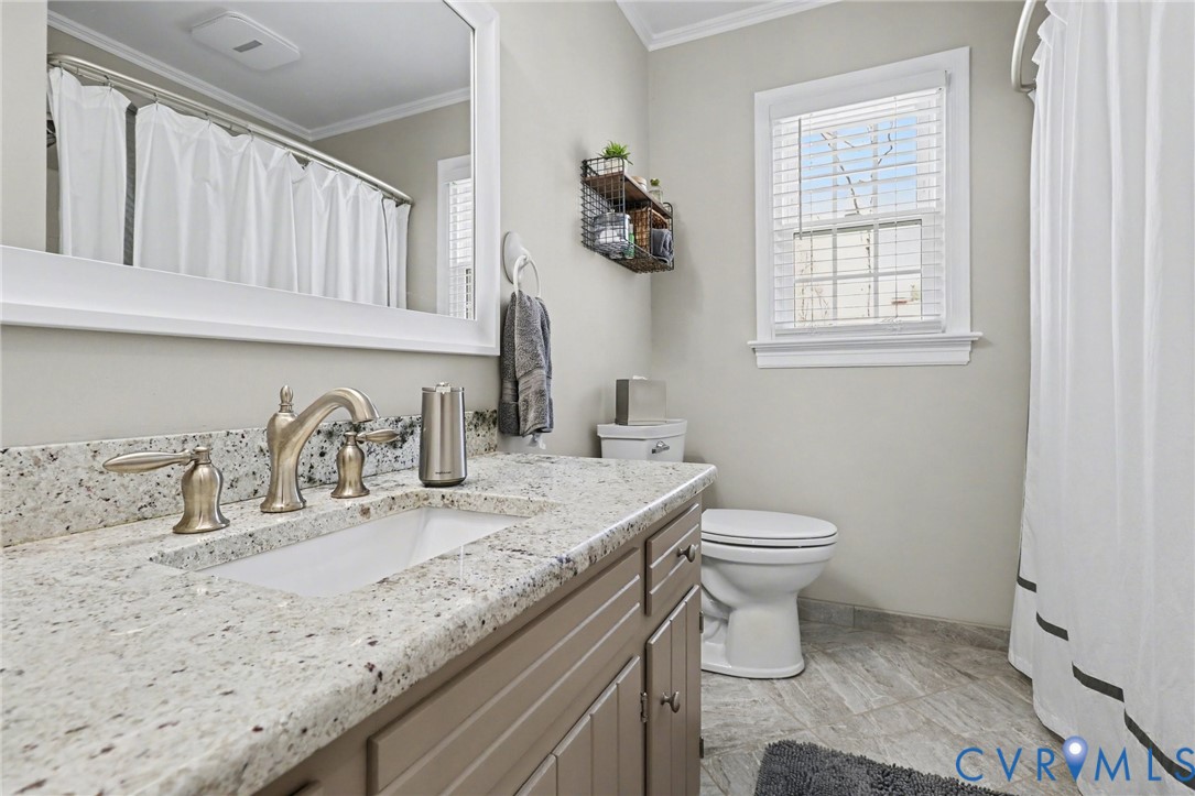 548 Glenmeadow Road Midlothian, VA 23114 - Photo 18 of 31 a bathroom with a granite countertop sink and a toilet
