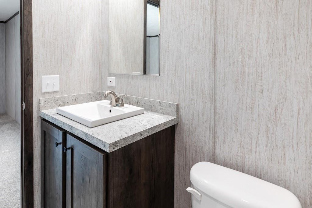 321 Beallsville Road Bentleyville, PA 15314 - Photo 17 of 26 a bathroom with a sink a toilet and a mirror