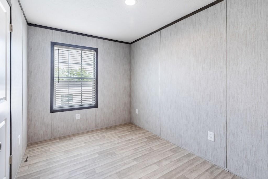321 Beallsville Road Bentleyville, PA 15314 - Photo 20 of 26 a view of an empty room with wooden floor and a window