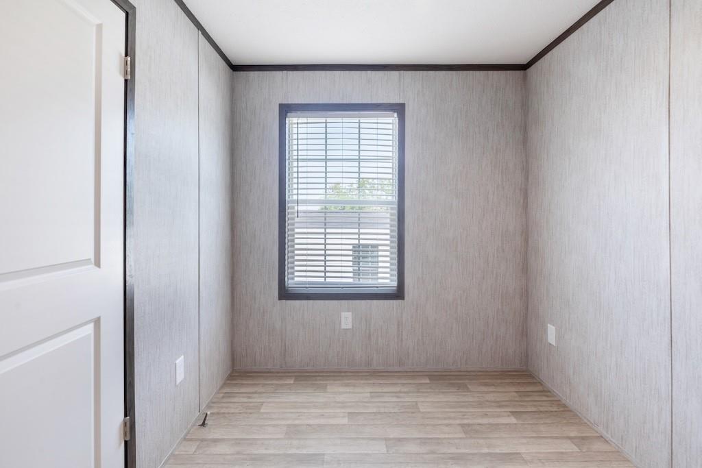 321 Beallsville Road Bentleyville, PA 15314 - Photo 22 of 26 a view of an empty room with wooden floor and a window