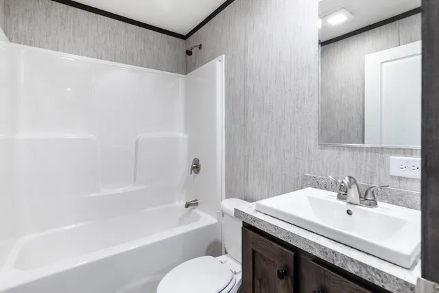 a bathroom with a sink toilet and bathtub