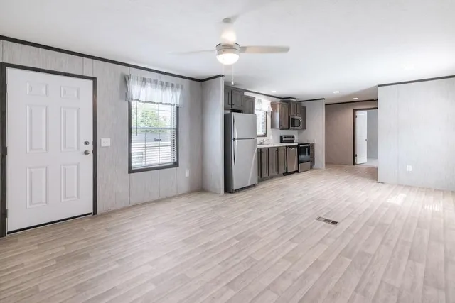 a view of a kitchen with a stove cabinets and wooden floor