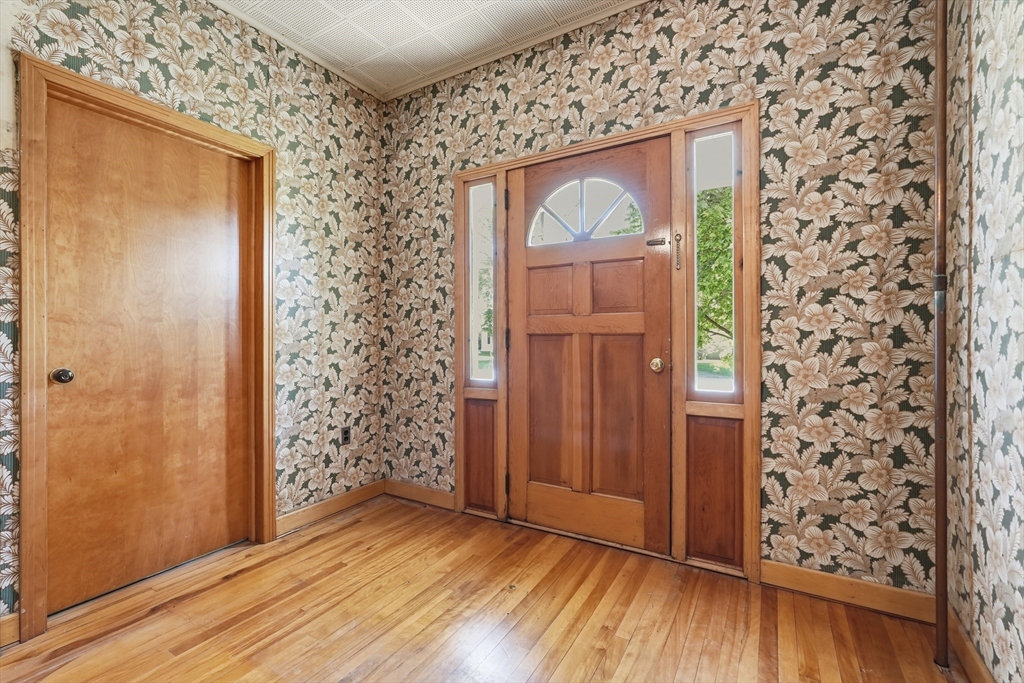 15 Main Street Hatfield, MA 01038 - Photo 5 of 42 an empty room with wooden floor mirror and door