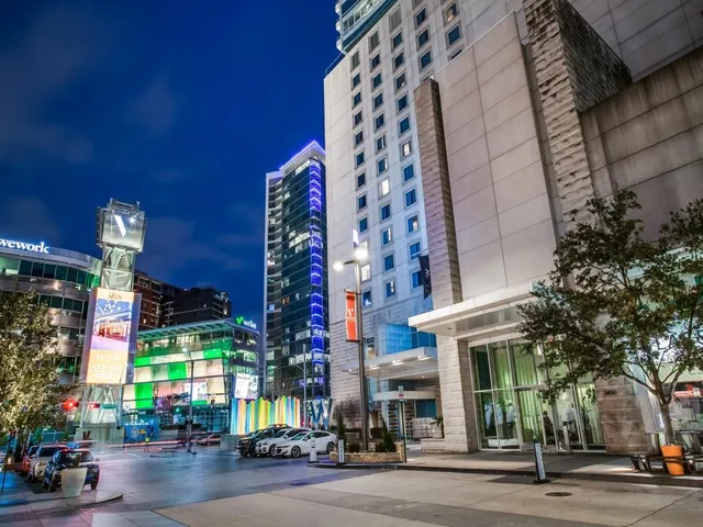 a multi story building with traffic signal lights