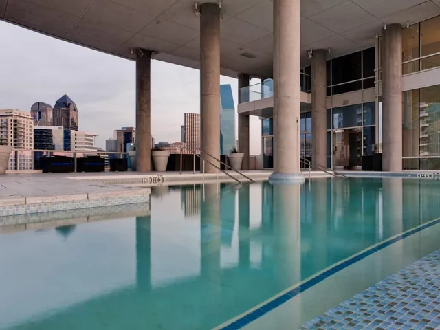 a view of a swimming pool and an outdoor seating