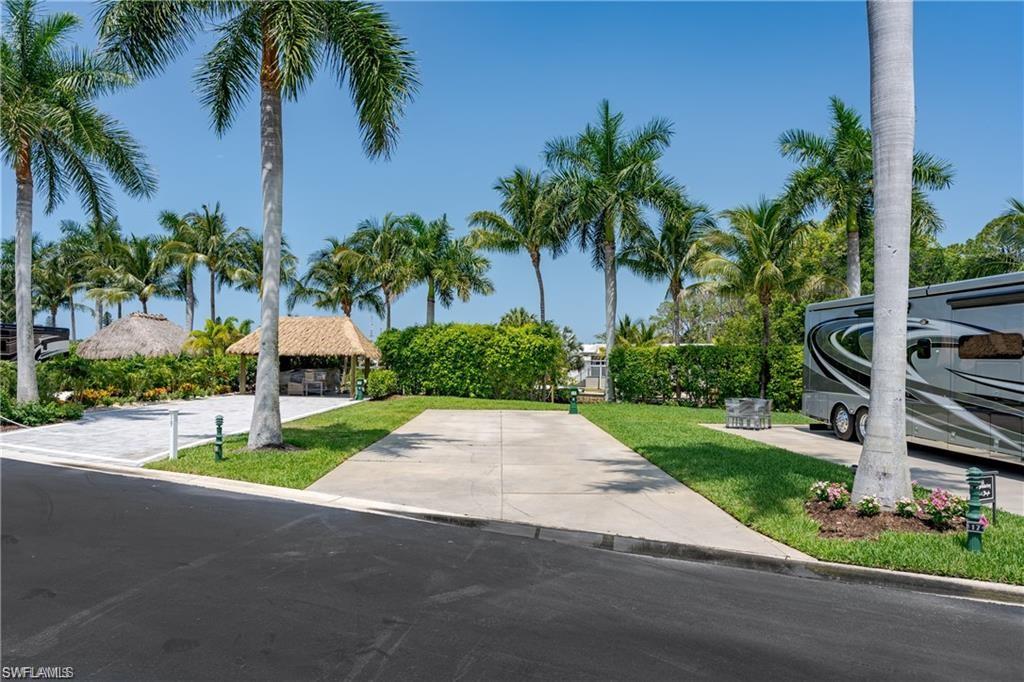 13375 Snook Circle Naples, FL 34114 - Photo 12 of 28 a house with palm tree in front of it