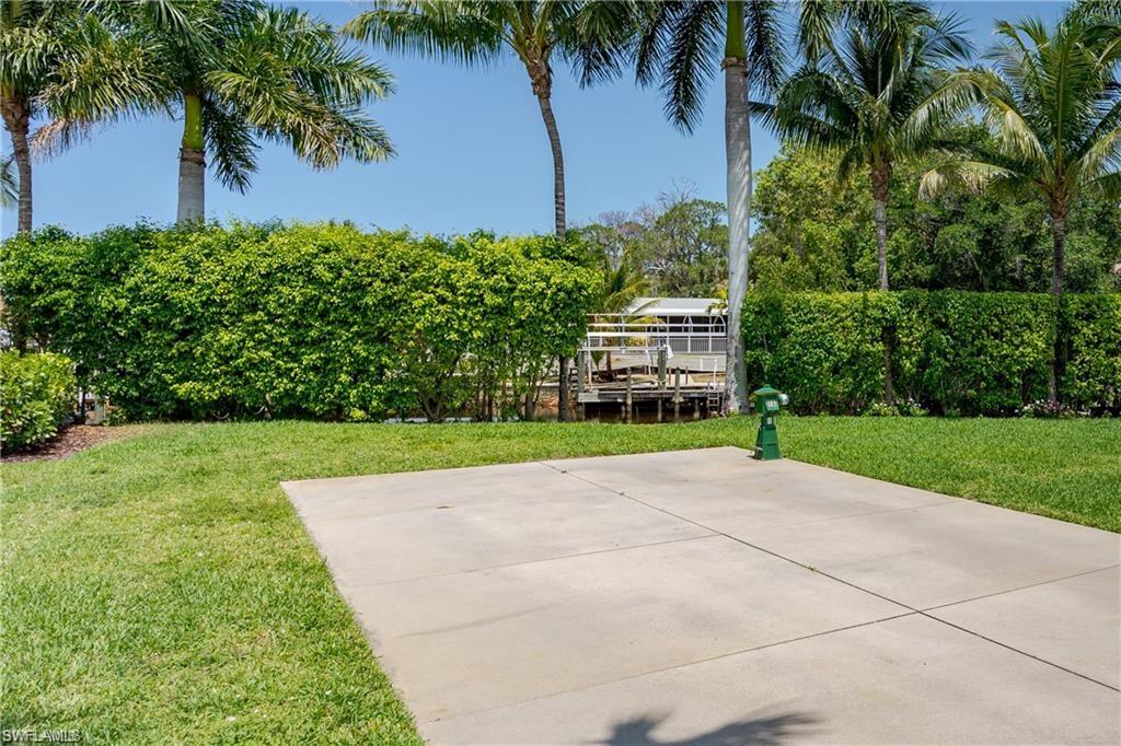 13375 Snook Circle Naples, FL 34114 - Photo 15 of 28 a view of a yard with palm trees