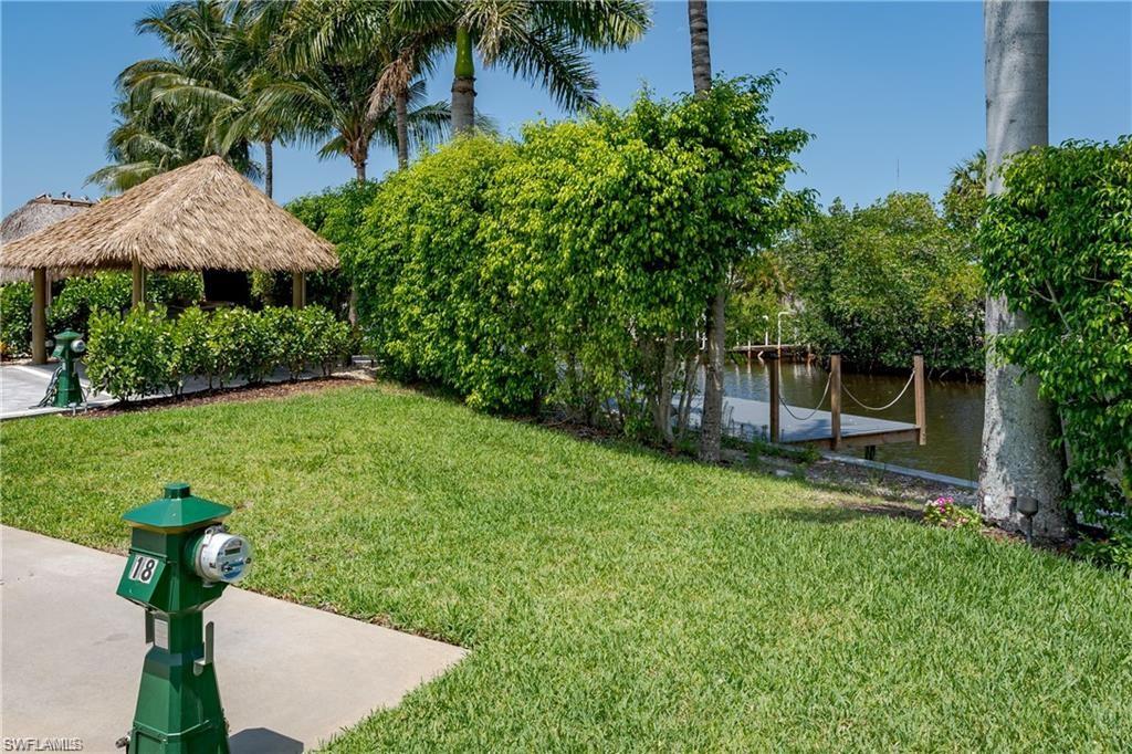 13375 Snook Circle Naples, FL 34114 - Photo 17 of 28 a view of a backyard with a garden