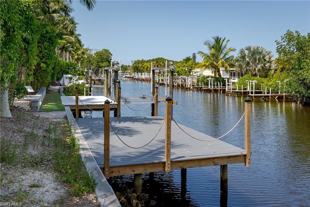 13375 Snook Circle Naples, FL 34114 - Photo 8 of 28 a swimming pool with chairs