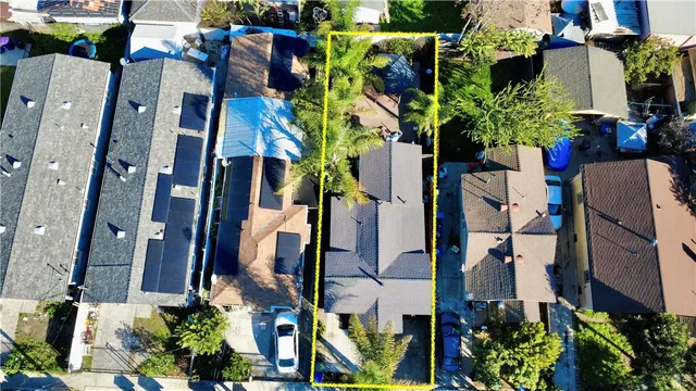 an aerial view of houses with street