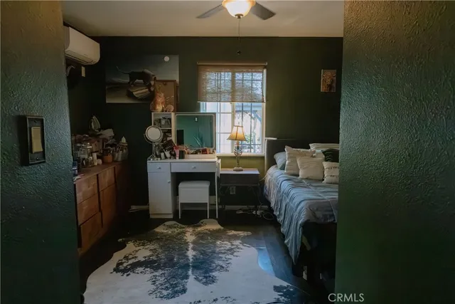 a bed room with a bed and a chandelier