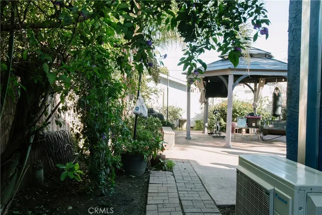 a view of a porch with chairs and floor to ceiling window