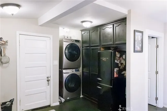 a view of a hallway with washer and dryer