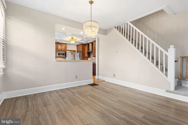 a view of an entryway with wooden floor