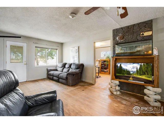 a kitchen with stainless steel appliances granite countertop a sink a stove and refrigerator