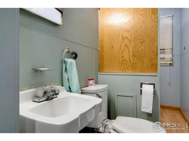 a bedroom with a bed and a view of bathroom