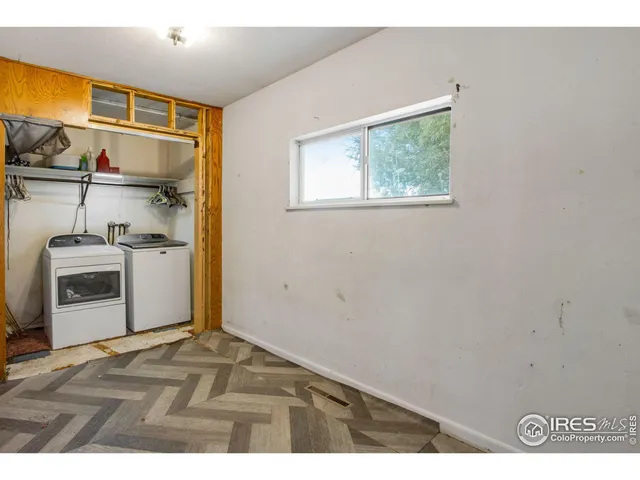 a bedroom with furniture and a wooden floor