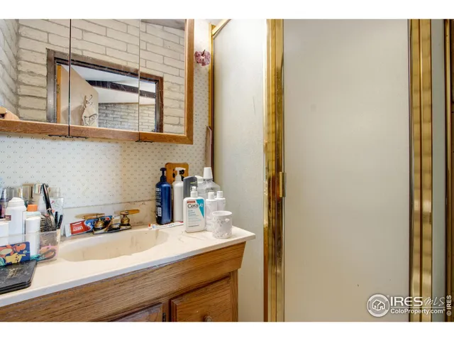 a bathroom with a sink and a large mirror