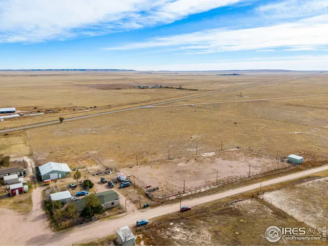 an aerial view of ocean and residential houses
