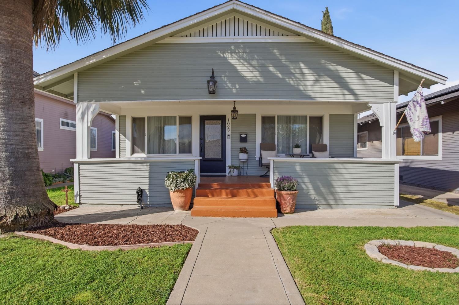 1029 Main Street Newman, CA 95360 - Photo 1 of 1 a front view of a house with a yard