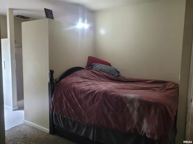 a close up of a bed in a room