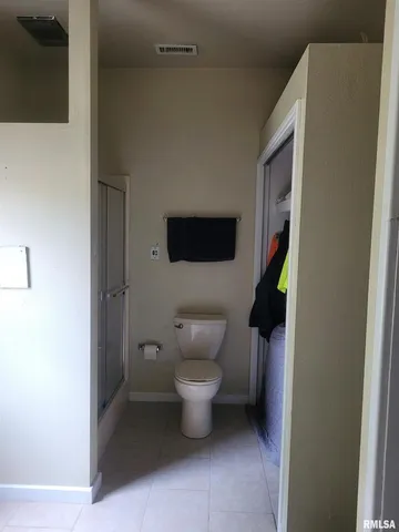 a bathroom with a toilet and a sink