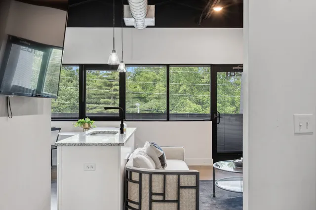 a dining room with furniture and window