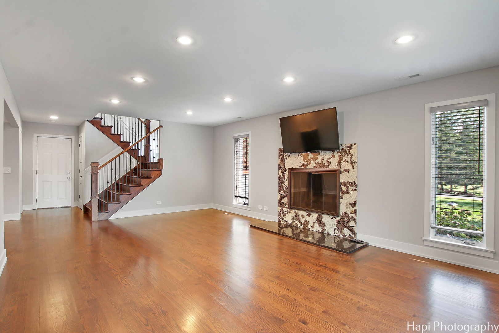 146 Harbor Drive Lake Barrington, IL 60010 - Photo 16 of 33 an empty room with wooden floor fire place and windows