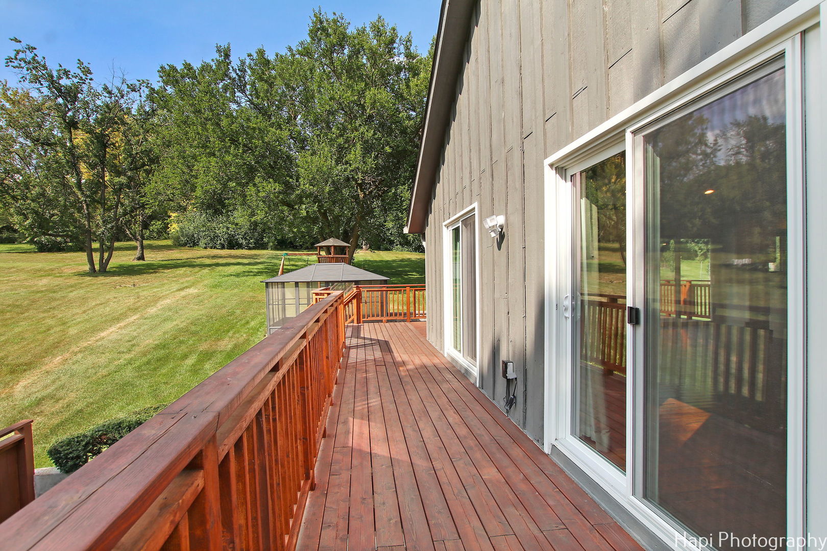 146 Harbor Drive Lake Barrington, IL 60010 - Photo 27 of 33 a view of a balcony with floor to ceiling windows with wooden floor