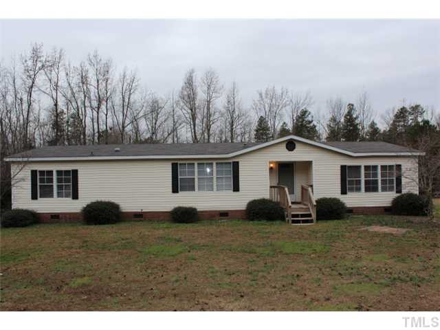 117 Vernon Hill Church Road Roxboro, NC 27574 - Photo 1 of 12 a house view with a garden space