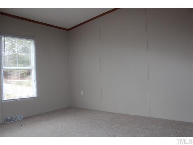 117 Vernon Hill Church Road Roxboro, NC 27574 - Photo 11 of 12 a view of an empty room with a window