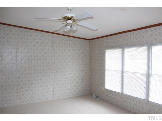 117 Vernon Hill Church Road Roxboro, NC 27574 - Photo 7 of 12 a view of an empty room and window